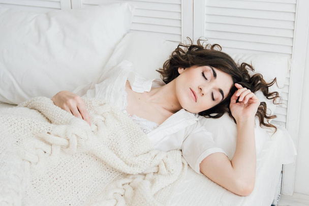Woman sleeping in bed  - Valokuva, kuva