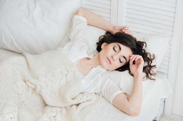 Woman sleeping in bed  - Valokuva, kuva