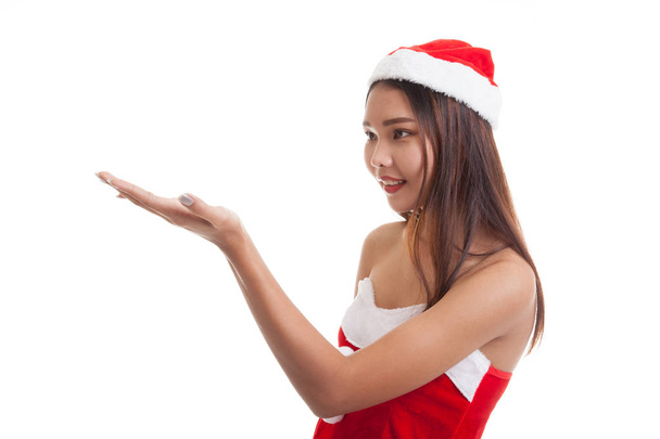 Asian Christmas Santa Claus girl  present space on her hand. - Zdjęcie, obraz