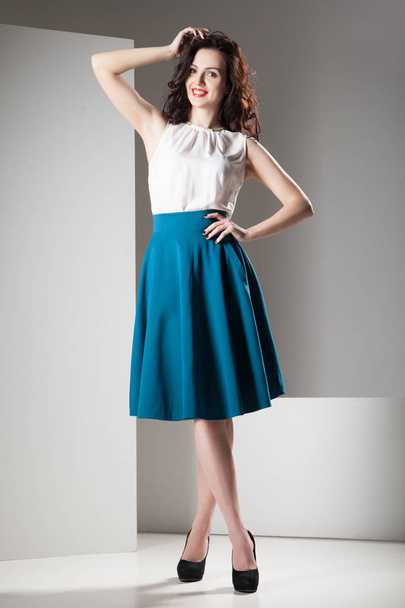 Colorful photo of a woman in white top and dark blue skirt - Foto, Imagem
