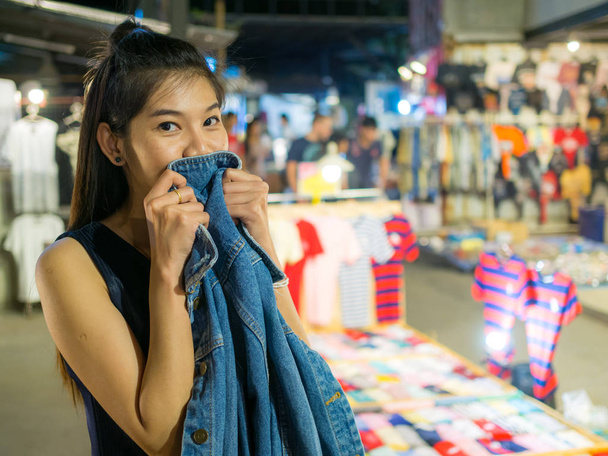 woman with shopping in night market - Photo, Image