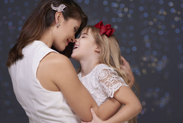 Elegant woman and her charming daughter - Photo, Image