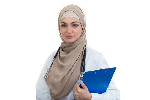 Confident muslim female doctor holding folder. - 写真・画像