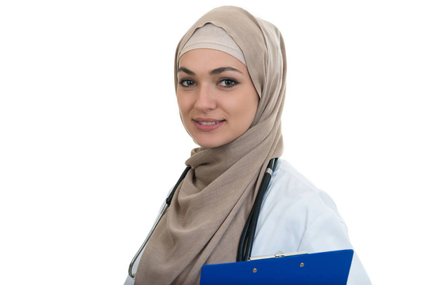 Confident muslim female doctor holding folder. - 写真・画像
