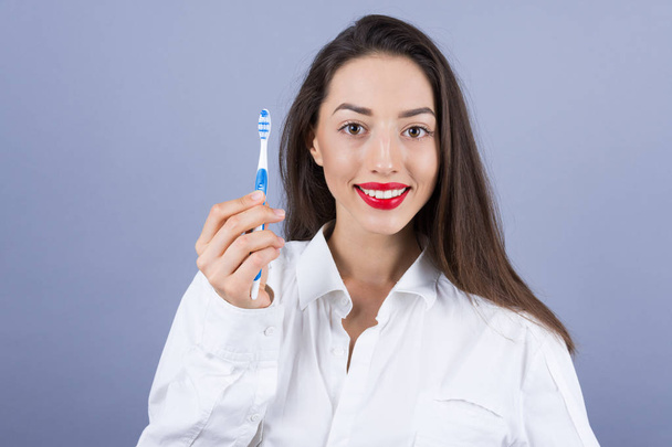 beautiful woman with toothbrush  - Valokuva, kuva