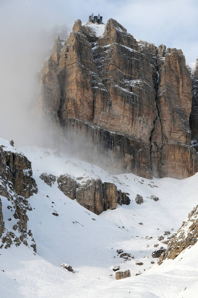 Sass Pordoi (in the Sella Group) with snow in the Italian Dolomites, from Pass Pordoi. Italy. - Foto, Bild