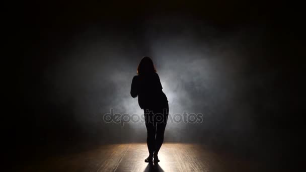 Dancer in the studio in smoke, silhouette. - Footage, Video