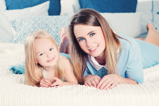 Happy Mother and Daughter Smiling. Happy Loving Family at Home - Фото, зображення