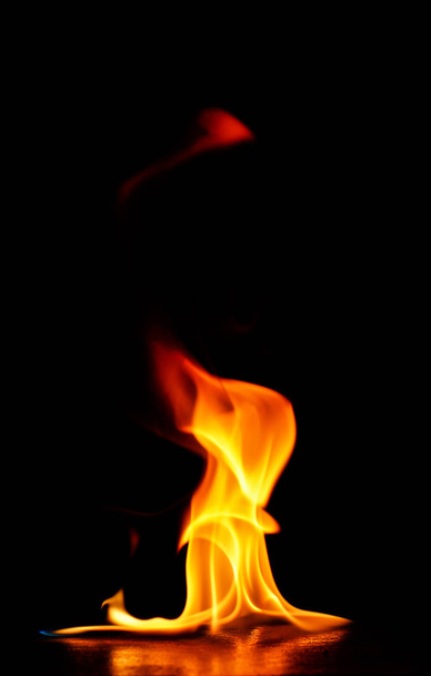 Beautiful fire flames on a black background. - Фото, зображення