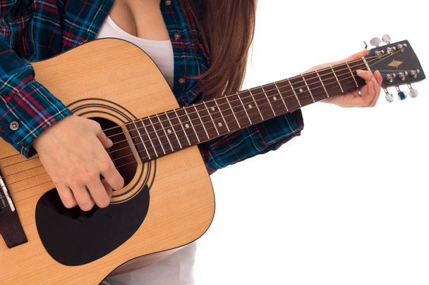 girl tunes the guitar - 写真・画像