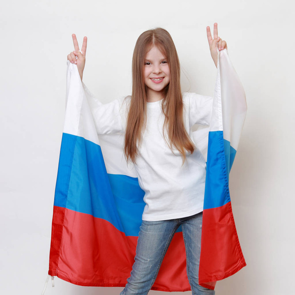 Little girl with Russian flag - 写真・画像