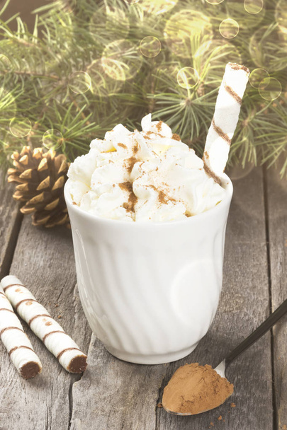 Cup of hot cocoa with cream on a dark background. Toning - Foto, Bild