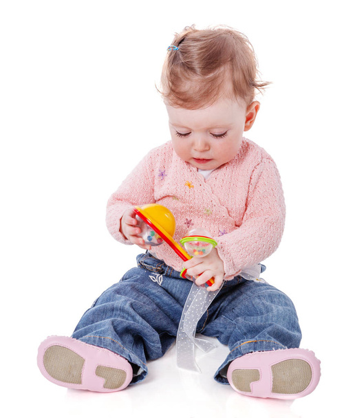 Girl playing rattle - Foto, Bild