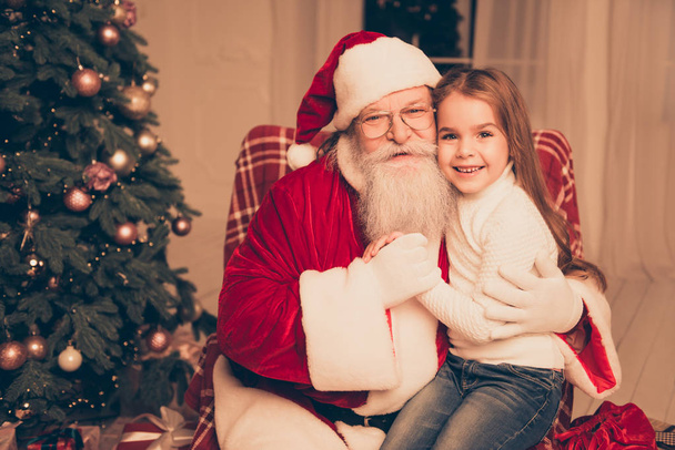 dream is real in christmastime! happy little cute girl sitting o - Foto, Imagen