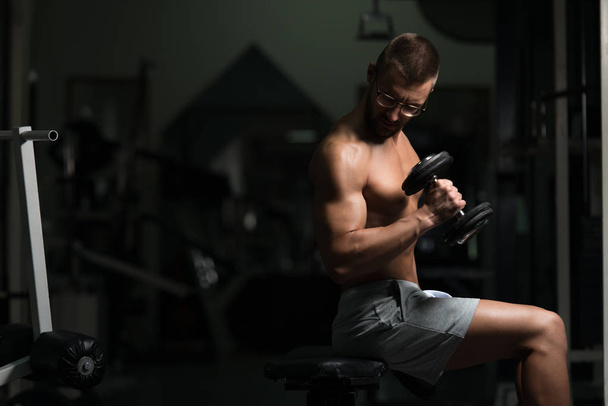 Geek Man With Dumbbell Exercising Biceps - Zdjęcie, obraz