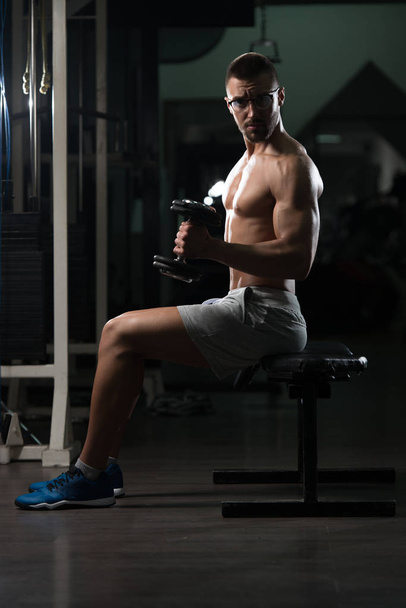 Biceps Exercise With Dumbbell In A Gym - Photo, Image