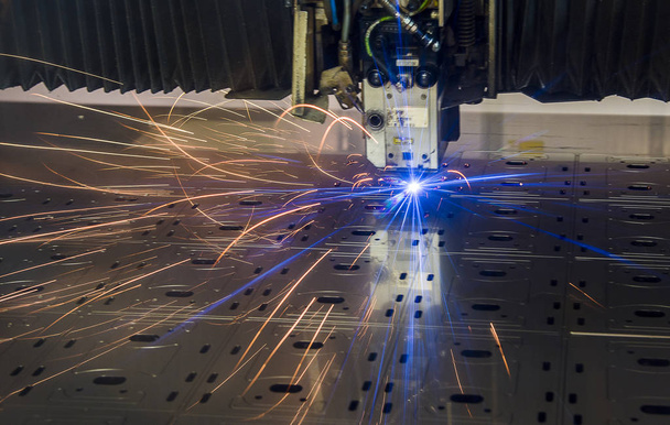 Industrial Laser cutting processing manufacture technology of flat sheet metal steel material with sparks - Photo, Image