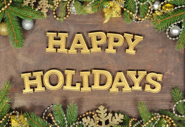 Boldog ünnepek golden szöveg és a fenyő ága és a karácsonyi dekoráció - Fotó, kép