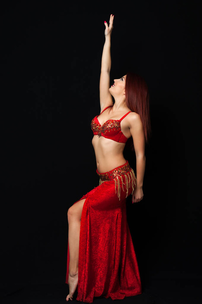 Beautiful belly dancer performing exotic dance - Fotografie, Obrázek