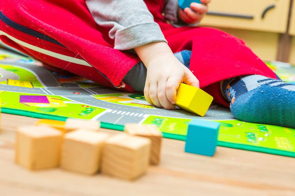 Small boy playing with wooden blocks - Photo, Image
