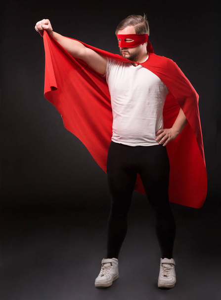 Young super hero man in studio - Fotó, kép
