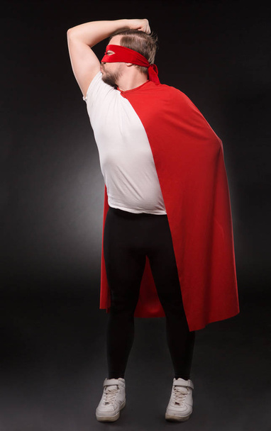 Young super hero man in studio - Fotó, kép