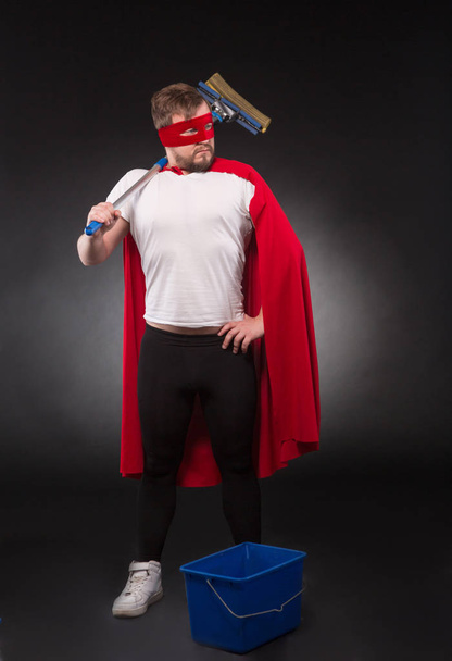 Super hero with cleaning equipment - 写真・画像