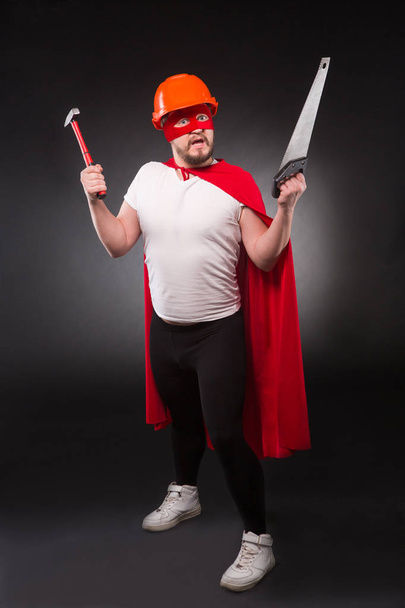 Super hero builder man in studio - Foto, Imagen