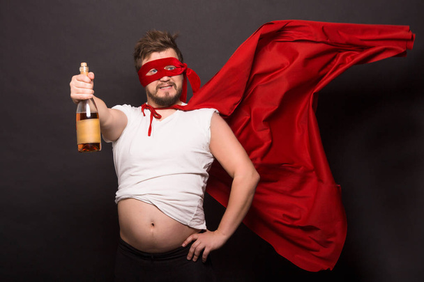 Super anti hero man drinking alcohol - Fotó, kép