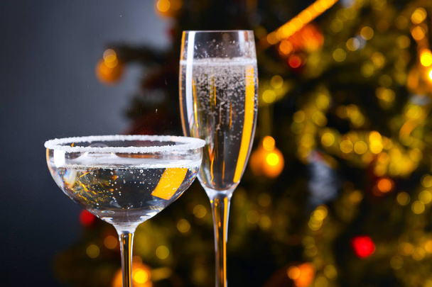 Two glasses with champagne and Christmas ornaments - Foto, Imagen