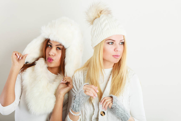 Two ladies in winter white outfit. - Foto, Imagen