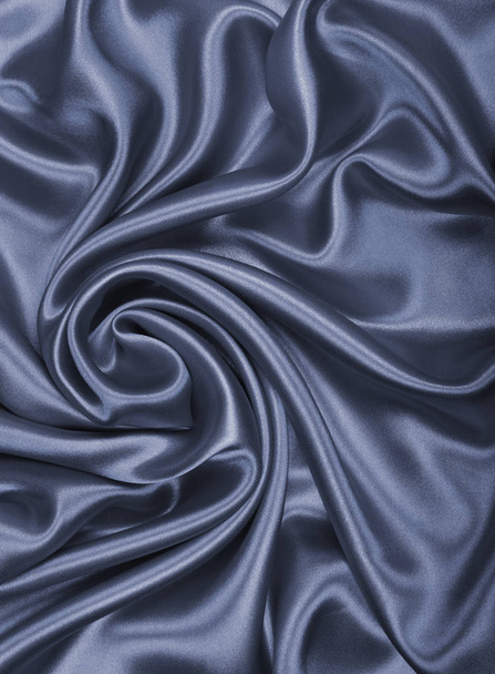 Smooth elegant dark grey silk or satin texture as abstract backg - Photo, image