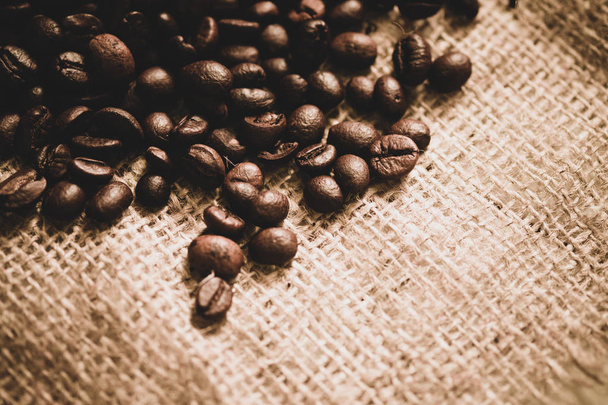 coffee beans on sackcloth with copy space - Fotó, kép