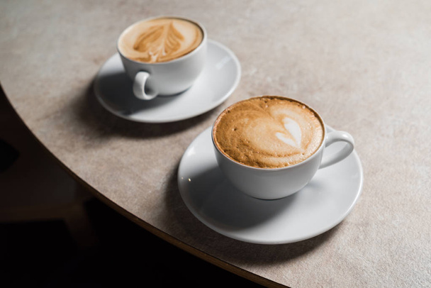 cups of cappuccino with foam  - Zdjęcie, obraz