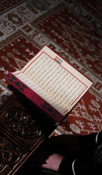 Muslim woman reading koran in mosque - Photo, Image