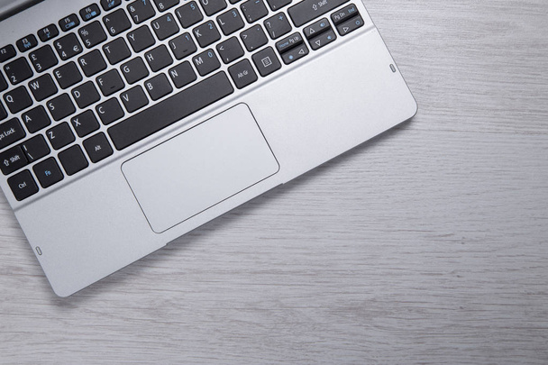 Grey toned overhead view of an open laptop - Foto, Imagen