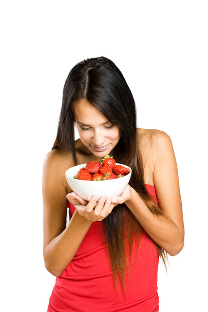 Beautiful thin brunette with strawberries. - Foto, Imagen