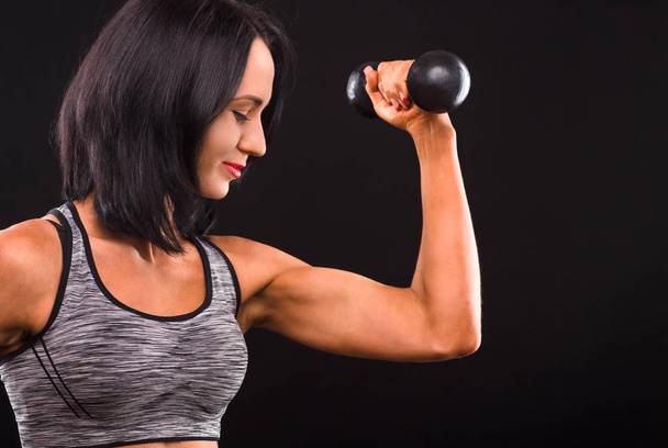 Fitness woman training with dumbbells - Photo, Image