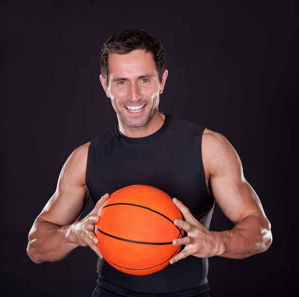 Young Man Holding Basketball - Fotó, kép