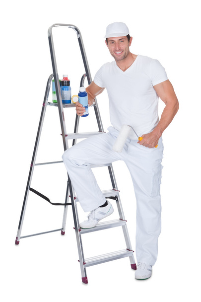 Painter Holding A Paint Roller And Paint Bottle - Photo, Image