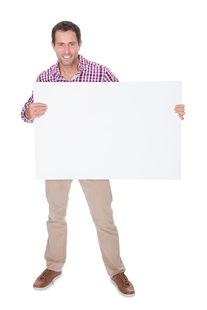 Portrait Of Young Man Holding Placard - Foto, Imagem