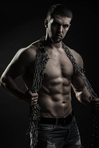 Muscular man with rope - Foto, Bild