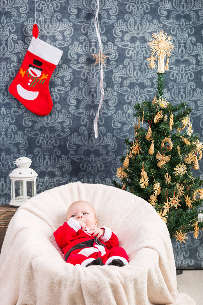 Beautiful little baby celebrates Christmas - Zdjęcie, obraz