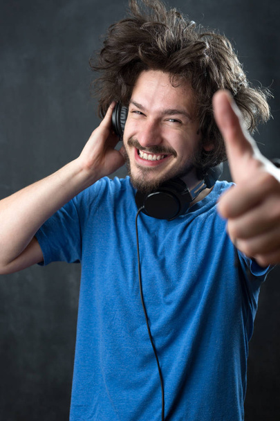 Man wearing  headphones - Fotó, kép