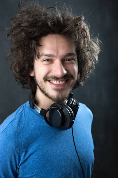 Man wearing  headphones - Fotografie, Obrázek