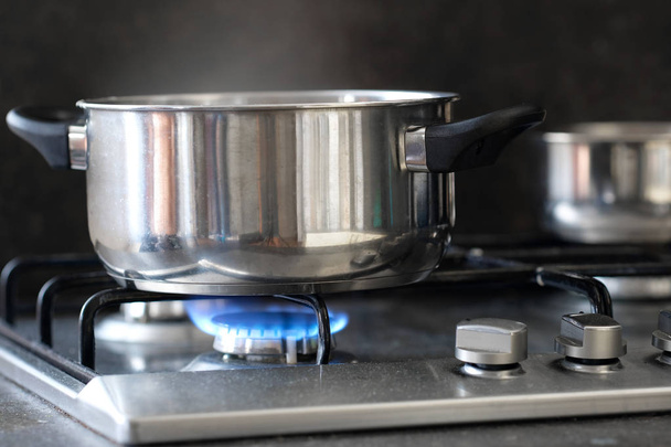 pot stands on a stove - Foto, Imagen