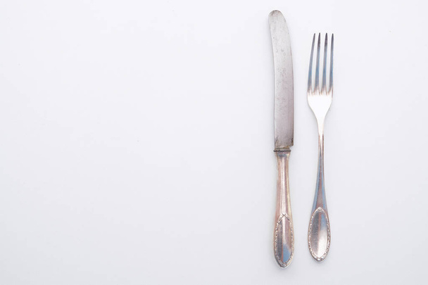 knife and fork isolated on white - beautiful silver cutlery - Photo, image