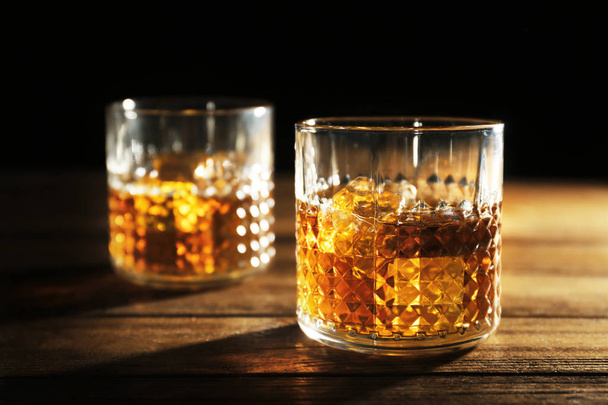 Glasses of whisky with ice - 写真・画像