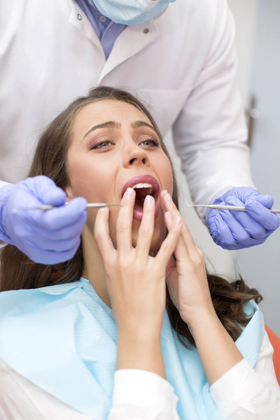 Patient having dental checkup - Foto, afbeelding