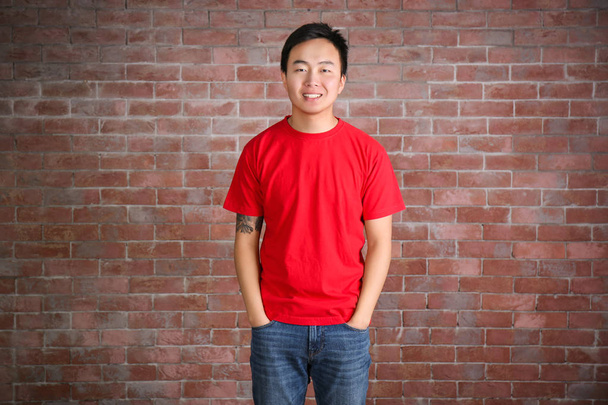 Asian man in blank red t-shirt - Foto, Imagen